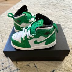 Brand New, Never Worn. Toddler Nike Jordan 1 Mid High Top Shoe. Sold Out. Lucky Green/Black/White. Size 5c. In Excellent Brand New Condition. Green High-top Synthetic Jordan Shoes, Green Jordan Shoes With Round Toe, Green Sneakers With Rubber Sole For Playtime, Green Jordan Shoes With Laces And Round Toe, Green Jordan Shoes With Round Toe And Laces, Nike Sneakers With Soft Sole For Playtime, Sporty Jordan Shoes With Round Toe For Playtime, Sporty Jordan Shoes For Playtime, Casual High-top Jordan Shoes For Playtime