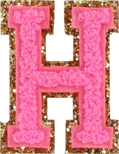 the letter h is made out of pink and gold sequinized fabric with flowers