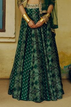 Emerald green attached cancan kalidar lehenga with all over bandhej bahar print and a hand embroidered waistline. Paired with a sleeveless inverted V hem bandhani printed blouse with floral aari, sequins, gota, dori, anchor and zardozi hand embroidered highlights and an aari-sequin vine border embroidered net dupatta. - Aza Fashions Vine Border, Embroidered Lehenga, Dupion Silk, Net Dupatta, Aza Fashion, Printed Blouse, Silk Printing, Emerald Green, Lehenga