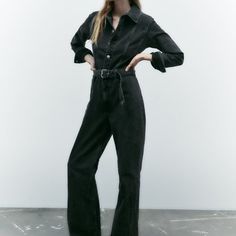 Long Lapel Collar Jumpsuit With Long Cuffed Sleeves. Self-Belt With Metal Buckle. Front Metal Button Closure. Anthracite Grey | 8197/252 13 Outer Shell 100% Cotton Black High-waisted Denim Jumpsuit With Pockets, Spring Black High Waist Denim Jumpsuit, Spring Black High-waist Denim Jumpsuit, Spring High Waist Black Denim Jumpsuit, Black Full-length Jumpsuits And Rompers For Fall, Spring High-waist Black Denim Jumpsuit, Fitted Black Denim Jumpsuit With Pockets, Black Long Sleeve Casual Overalls, High Waist Black Denim Jumpsuits And Rompers