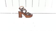 "Musse and Cloud open toe platform brown leather sandal/high heel strappy leather sandals/37 Measurements... - marked size: 37 - insole length: 9.25\" -width at ball: 3\" -heel: 3.75\" -front platform: 1.5\" Features... -genuine leather -high platform -4 adjustable straps -wooden/resin platform Condition... -excellent condition -gently worn...minimal wear DC2*" Brown Sandals With Wooden Heel For Party, Party Sandals With Wooden Heel In Brown, Brown Chunky Platform Sandals For Party, Brown Leather Strappy Heels, Leather Strappy Platform Heels, Strappy Leather Platform Heels, Brown High Heel Sandals With Chunky Platform, Brown Ankle Strap Sandals With Chunky Platform, Brown Chunky Platform Sandals With Ankle Strap