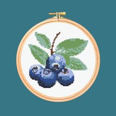 a cross stitch pattern with some blueberries on it