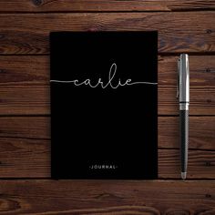 a black notebook with the word caulie written in cursive writing on it