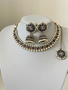 This beautiful Monalisa stoned set that comes with cute jhumka earrings and tikka.  The earrings to this set a cute size for all customers that do not want anything got big for heavy.  Please follow our Instagram page  @sakavano_jewellery for all our latest offers.  Please note we do not offer any refunds or exchanges due to hygiene reasons. Indian Choker, Blue Choker, Page Instagram, Indian Navy, Choker Set, Jhumka Earrings, Wedding Jewellery, Wedding Jewelry Sets, Indian Jewellery