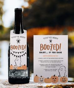 a bottle of boozed wine next to a card