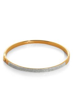 Sparkling pavé diamonds elevate a slender bangle bracelet crafted in 18-karat gold vermeil or sterling silver for elegant style. Exclusive US retailer 6 1/2" inner circumference; 1/8" width Hinge closure Total diamond weight: 0.45ct. (Small); 0.47ct. (Medium); 0.53ct. (Large) Color: H/I Clarity: I1 Recycled sterling silver/18k gold/diamond Imported >Diamond Guide Recipient of the Butterfly Mark certification, which identifies luxury brands that adhere to social and environmental best practices T Gold Bracelets With Pave Setting For Everyday Luxury, Modern Diamond Bangle With Pave Setting, Everyday Luxury Gold Diamond Bracelet With Pave Setting, Anniversary Bangle Gold Bracelet With Pave Setting, Everyday Luxury Gold Bracelet With Pave Setting, Modern Gold Bracelet With Pave Setting, Gold Diamond Bangle Bracelet With Pavé Setting, Gold Bangle Bracelet With Pave Setting, Gold Bangle With Pave Setting For Everyday Luxury