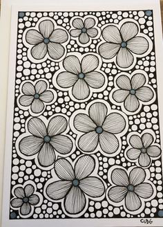 a black and white drawing of flowers with dots on the bottom, surrounded by circles