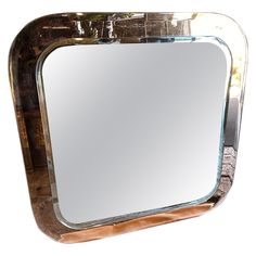 a mirror that is sitting on top of a table