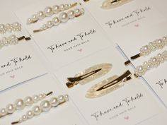 several different types of hair clips with pearls on them