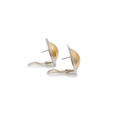 Brand: James Avery  Gender: Ladies  Metal Type: 14 Karat Yellow Gold & 925 Sterling Silver  Diameter: 28.00 mm  Width: 28.00 mm  Weight: 20.20 grams  One pair of ladies matte finished 14K yellow gold and silver earrings with omega-wire backs. Engraved with "14K". The "JAMES AVERY" trademark (or hallmark) can also be found on the item.  Pre-owned in excellent condition. Might shows minor signs of wear.  Please reference the dimensions noted in the description above for the most accurate measureme Timeless Polished Finish Earrings For Anniversary, White Gold Oval Earrings Tarnish Resistant, Timeless Earrings For Anniversary With Polished Finish, Oval White Gold Earrings Tarnish Resistant, Timeless Clip-on Yellow Gold Jewelry, Gold Domed Jewelry For Anniversary, Hammered White Gold Earrings For Anniversary, Tarnish Resistant Domed Jewelry Gift, Domed Tarnish Resistant Jewelry For Gifts