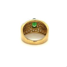 Vintage tsavorite and diamond cluster ring in 18k solid gold. Featuring a richly colored oval cut green and round cut diamond side stones. Mounting in a two-toned solid gold setting.   Tsavorite is a rare form of Garnet called Green Grossularia.   Item Details: - Type: Vintage Ring  - Metal: 18K White, Yellow Gold  - Weight: 12.2 grams  - Setting: Prong  - Size: 8  _____________________________  Center Stone Details: - Type: Tsavorite  - Carat: 1.50 (approx.) - Cut: Oval  - Color: Green  - Measu Oval Emerald Ring With Pave Setting, Heirloom Oval Green Diamond Ring, Heirloom Green Oval Diamond Ring, Brilliant Cut Oval Diamond Ring With Tsavorite, Green 14k Stamped Diamond Ring, Green Oval Jewelry With Pave Setting, Oval Tsavorite Diamond Ring For Formal Occasions, Luxury Green Diamond Ring Stamped 14k, Green Oval Diamond Ring Fine Jewelry