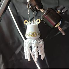 an octopus keychain is attached to a camera