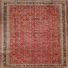 an antique persian rug with red and blue colors, on a white background is shown