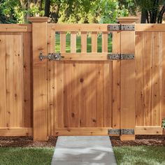 a wooden gate in the middle of a yard