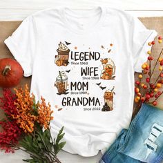 Legend Wife Mom Grandma Est Year Fall Latte Halloween CTH01 T-ShirtGreat as Birthday gifts or Holiday presents. This adorable item can be designed upon anyone's wish with any title.Please enter:1. Nickname. ie. Grandma, Nana, Mimi, ...etc.2. Kids' Names wanted on the shirt (Names separated by commas)All items are made to order.* Please be aware that the physical product's colors may differ slightly from the mockup. Brand: Gildan Classic unisex cut makes this easy to fit the body. Material: Heavy Pumpkin Spice Shirt, Pumpkin Latte, Grandma Shirts, Autumn Coffee, Mom And Grandma, Personalized Clothes, Coffee Shirts, Thanksgiving Shirts, Halloween Tees