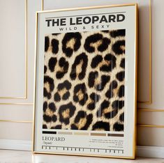 the leopard print is displayed in front of a white wall