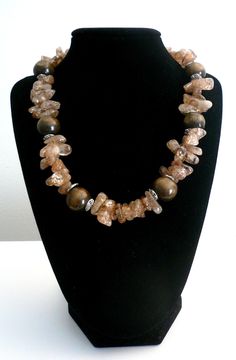 "Earthy Mocha & Chocolate Rutilated Quartz Wood Necklace. Wood Fall Necklace, Neutral Necklace. Fall 2018 Jewelry Trends This is a beautiful Mocha and Chocolate Rutilated quartz and wood necklace. Soft Earth Tones can be worn very frequently with many styles. Neutral so goes perfectly with many colors Perfect for Fall Silver Tone Toggle Closure. Approx 17 inches long *If you have have any questions regarding this item, please hit the \"Ask a Question\" button next to the price and I will get Brown Stone Necklaces For Gifts, Brown Stone Necklace For Gift, Brown Necklaces With Stones For Gifts, Spiritual Brown Stone Necklace, Brown Gemstone Beads Necklace For Gift, Brown Gemstone Beads Crystal Necklace For Gifts, Soft Earth Tones, Fall Necklace, Mocha Chocolate