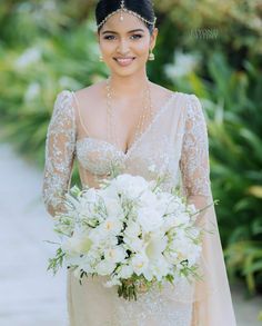 a woman in a wedding dress holding a bouquet