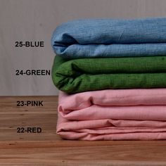 four different colored linens stacked on top of each other with the measurements for them