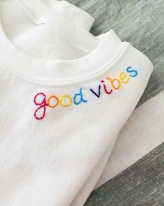 two shirts with the words good vibes embroidered on them