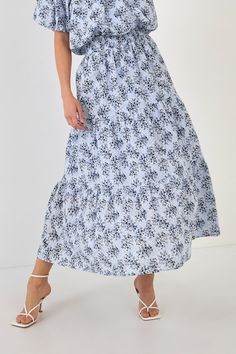 The perfect skirt for a summer day. This tiered maxi skirt is perfect for a summer day. With an elastic waistband and shirring throughout, it's comfortable and flattering. You'll love the pretty floral print too. Style this skirt with sandals or wedges for a casual look, or dress it up with a blouse and heels. Tiered maxi skirt Elastic waistband Shirring throughout Hand wash cold Do not bleach Do not tumble dry Iron low Shell: 100% Cotton Lining: 80% Polyester 20% Cotton TL645K Total lenght:37.5 Summer Flowy Tiered Maxi Skirt, Spring Tiered Maxi Skirt, Flowy Tiered Maxi Skirt For Summer, Casual Tiered Bottoms With Floral Print, Summer Tiered Maxi Skirt With Elastic Waistband, Summer Floral Print Midi Maxi Skirt, Summer Style Gathered Maxi Skirt, Blue Flowy Tiered Maxi Skirt, Blue Tiered Maxi Skirt For Day Out