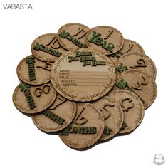 a pile of wooden coasters with the words happy new year written in green on them