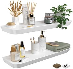 two white shelves filled with different types of bathroom items and plants on top of them