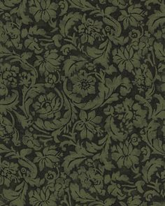 a green and black floral pattern on fabric