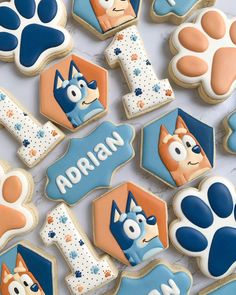 decorated cookies with the characters of paw patrol and alphabet on them are displayed in front of a white background