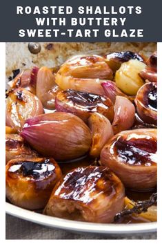 roasted shallots with buttery sweet - tart glaze on a white plate