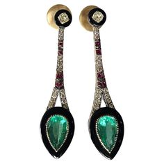 A very gorgeous and special, Art Deco style, Emerald, Black Onyx & Ruby Drop Chandelier Earrings set in 18K Yellow Gold & natural Diamonds. The weight of the Emeralds is 3.85 carats. The Emeralds are completely natural, without any treatment and are of Zambian origin. The weight of the Black Onyx is 3.70 carats. The weight of the Rubies is 0.30 carats. The Diamonds weight is 0.87 carats. Net 18K Yellow Gold weight is 12.39 grams. The Gross weight of the Earrings is 14.13 grams. The dimensions of the Earrings are 5.50cm x 1.50cm x 0.60cm (L x W x D). The Earrings have a push back. ✦ Handmade / Handcrafted Fine Jewelry ✦ Gemstone: natural Zambian Emerald ✦ Gemstone Cut: Pear ✦ Gemstone Weight: 3.85 ct. Approx. ✦ Gemstone: Black Onyx ✦ Gemstone Cut: Custom Cut for this Earring ✦ Gemstone Weig Earring Video, Art Deco Emerald, Drop Chandelier, Diamond Chandelier Earrings, Diamond Chandelier, Columbian Emeralds, Diamond Dangle Earrings, Gold Art Deco, Estilo Art Deco