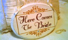 there is a sign that says here comes the bride