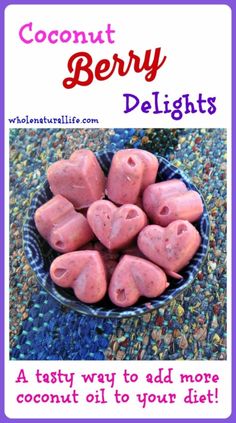 a bowl filled with heart shaped candy on top of a table