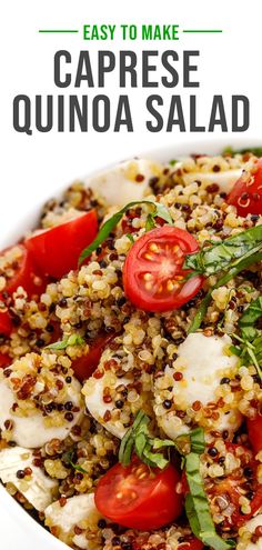 a white bowl filled with quinoa salad and topped with tomatoes