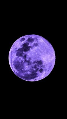 the full moon is shown in purple light