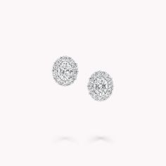 Simply stylish jewels that you will wear time and time again, our white gold Icon oval diamond stud earrings from the Icon collection are exquisite. Inspired by Laurence Graff's abiding passion for diamonds, the centre stones are encircled by a radiant halo of pavé diamonds. Named after the famous Icon diamond – a 90.97 carat D Flawless round brilliant diamond that was cut and polished by Graff in 2000 – the Icon collection celebrates the incomparable beauty of one of Mother’s Nature’s most prec Designer Stud Earrings, Real Diamond Earrings Studs, Graff Earrings, Designer Diamond Earrings, Graff Jewelry, Diamond Shaped Engagement Ring, Radiant Halo, Graff Diamonds, Round Diamond Pendant