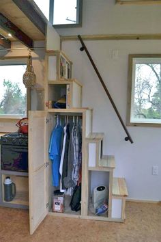 a room with some shelves and stairs in it