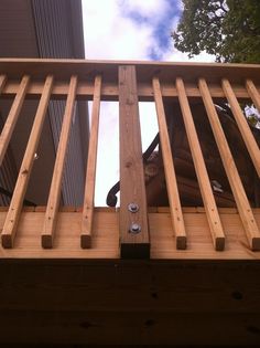 a close up of a wooden rail on a building