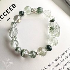 Green Phantom Quartz design with 925 silver bead Support your energy for career development. The bracelet is design in 15.5-16cm, if you need to adjust the size please let us know :) EMBRACE THE CREATION OF MOTHER NATURE Every piece of crystal is the creation of nature, there might be slightly difference and nature inclusion. We try our best to control every item same with the photo shown. FOLLOW US! Follow us on Facebook and Instagram to get updates: @PhenixCrystalShop VISIT US! Come to visit u Silver Adjustable Crystal Bracelet For Meditation, Casual Silver Round Crystal Bracelet, Sterling Silver Crystal Bracelet With Round Beads For Healing, Modern Silver Bracelets With Gemstone Beads, Casual Silver Bracelets With Gemstone Beads, Modern Stretch Bracelet With Round Beads As Gift, Casual Silver Crystal Bracelet With Round Beads, Hypoallergenic Silver Bracelets For Meditation, Silver Healing Stretch Bracelet