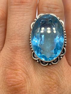 Large genuine aqua blue volcanic art glass Vintage ring Low content silver not sterling. Size 8 Our jeweler can re size this for a 20 fee.  All rings are shipped in a nice gift box.   Check out our over a THOUSAND great reviews Engraving is $4 per letter and is not always perfect depending on the piece. It can take a few days if the jeweler is busy. This is payable to Paypal Judithsltd@gmail.com Spiritual Blue Topaz Jewelry As A Gift, Large Stone Topaz Ring Gift, Large Stone Topaz Round Ring For Gift, Aquamarine Cabochon Jewelry Gift, Blue Cabochon Topaz Ring For Anniversary, Gift Large Stone Topaz Ring, Silver Blue Topaz Crystal Ring For Gift, Unique Blue Crystal Ring For Anniversary, Spiritual Blue Topaz Jewelry In Blue