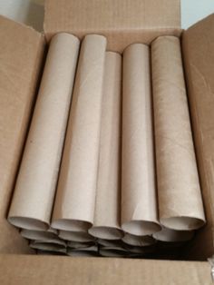 several rolls of toilet paper in a cardboard box