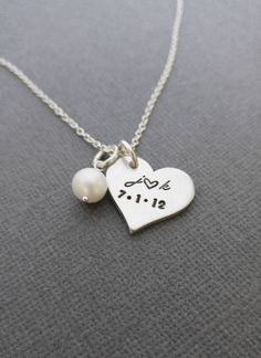 "« Personalized Necklace with Initials and Date // Anniversary Necklace // Hand Stamped Jewelry // Hand Stamped Necklace » Have this pretty heart pendant hand stamped with the initials and date of your choice to make the perfect gift! This necklace makes such a cute gift or keepsake and a cute way to carry a meaningful part of your life with you. The 3/4\" heart and freshwater pearl are hung from an 18\" oval link chain. Please let me know in the 'note to seller' box during checkout with the ini Meaningful Heart-shaped Wedding Jewelry, Personalized Heart Pendant Necklace For Wedding, Personalized Pendant Heart Necklace For Wedding, Silver Hand Stamped Heart Necklace For Anniversary, Heart-shaped Wedding Necklaces, Personalized Heart Pendant Charm Necklace For Wedding, Heart Necklace With Charms For Valentine's Day Wedding, Wedding Personalized Heart Pendant Charm Necklace, Valentine's Day Wedding Heart Necklace With Charms