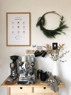 a coffee machine sitting on top of a wooden table