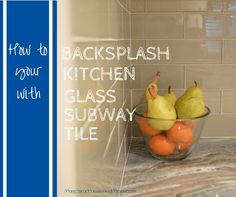 a glass bowl filled with pears and oranges on top of a kitchen counter