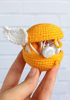 a crocheted toy with headphones in it