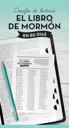 an open book with a pencil on top of it and the words el libro de mormon