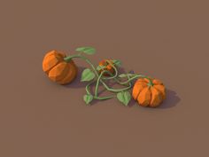 three small pumpkins with green leaves on a brown and tan background, one is still attached to the vine