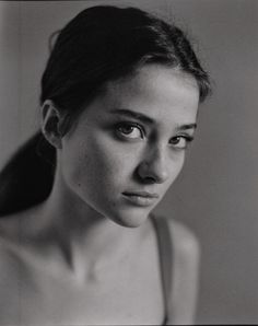 a black and white photo of a woman's face