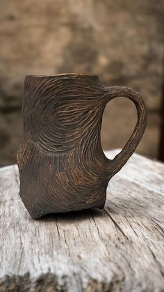 a coffee cup sitting on top of a wooden table