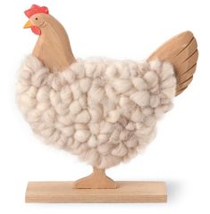 a white and brown chicken is standing on a wooden stand with wool in it's hair